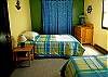 Cheerful twin beds in the third bedroom
