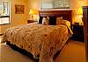 The master bedroom with king-size bed is on the upper level.