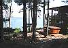 The lower level features a large hot tub and outdoor sauna.