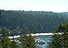 From the outside picnic tables take in the views of the marinas of Deer Harbor. This home is perched above the action on a rocky knoll. Gaze southeast down the harbor or east out at the snow capped volcano, Mount Baker.
