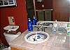whimsical sinks and nice tile in the guest bath.