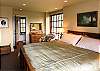 Large and luxurious, the master bedroom offers period detail, king size bed with luscious silk comforter, TV, comfortable seating, private view deck. Master bath has soaking tub.