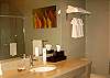 great bathrooms with big showers and large limestone vanity counters