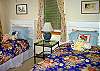 Two twin beds are located in the third bedroom.