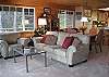 Cozy seating looking toward the water. Dining table has leaves to seat 8.