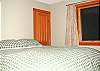The private bedroom offers a queen bed.