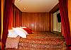 Climb up into this sleeping compartment, draw the drapes, and escape into fantasy. In this cozy blissfull dreamland, the TV is for DVD only.
