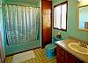 Full bath and shower in the upper level bathroom