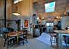 The cheerful kitchen, dining area, and wood stove.