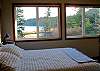 Both upper level bedrooms share a view of Thompson Point and Mount Baker.