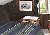 The upper level has two sleeping spaces each with it's own comfortable bed. One bed is a double and one a twin.