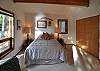 There's a queen size bed in the master bedroom.
