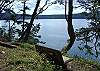 There is a gently sloped path that leads closer to the water, but note that there is a sheer drop below. No beach access.