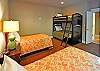 Main level room with two twin beds and set of bunks. Bath for this room is just outside the door.