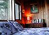 All rooms of this all cedar home offer a warm rustic environment and an extensive collection of eclectic and spiritual decor.