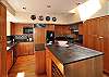 What a fabulous kitchen! High quality cabinetry, soapstone counter tops, Brazilan cherry hardwood floors, large prep island, & Viking range will please the gourmet chef in the group.