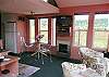 A fireplace and wall mounted TV with HD and DVD.