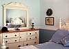 Guest room offers a queen bed.