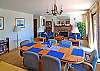 Upper great room with dining area opens to deck.