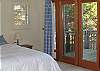 Views of the water can be seen from windows to the right of the bed in the master bedroom.