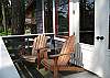 Two Adirondack chairs grace the deck.