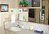 The bathroom of the lower level suite offers a shower.