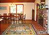 A second open hearth fireplace is located near the dining area.