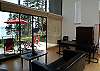 Dining area and blinds installed to filter out the neighboring home.