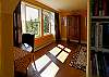 Find an east facing wall of window, small library and perfect table in the quiet master suite.