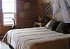 Upper queen bedroom with a deck on the waterside.