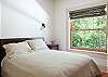 This bedroom with queen bed is at end of the hall on the main level.