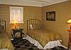 The east cabin offers privacy, twin beds, a writing desk, reading light, antiques and art.