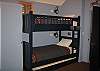 Pictured is the second set of custom bunk beds with three beds (including trundle).
