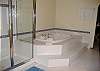 There's a large soaking tub and separate shower in the master bathroom.