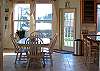 Captain Cooks has a great room floor plan and sunken living room. The dining area with seating for 6 is centrally located between the large foyer, living room, kitchen. and patio. Two stools are available at the black granite bar for additional seating.
