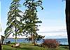 From the master bedroom walk out on to a private deck to take advantage of this lovely view to the north to Sucia Island and Georgia Strait and beyond.