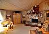 Washed woods and fireplace warm up the living area.