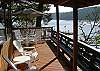 Look over quiet Neil Bay from the expansive partly covered deck of this cottage.