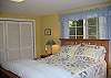 Bedroom offers a comfortable queen size bed.