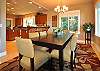 Dining table seats 12. Also bar stools at kitchen counter.