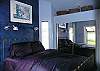 The full size antique bed continues the romantic dream with European flair - open the French Doors at night to bring in the stars.