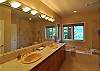 Master bath with soaking tub and separate tiled shower.