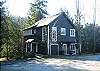 The Main House sits on a rocky knoll above Boss Lake.