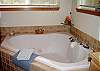 This delightful cottage offers a soaking tub.
