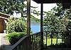 Looking across grassy yard to the water from the cottage