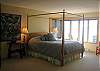 The bedroom opens to the deck and has wonderful water views.