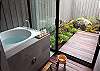 A soothing indoor/outdoor experience awaits when you clamber into this deep soaking tub. Take your pick of shower - indoors or out, both open on ipe flooring.