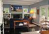The open floor plan of the Main House offers views of Boss Lake.