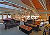Seating and pool table in the loft.