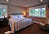2nd master bedroom with king bed is upstairs. Room also has TV.